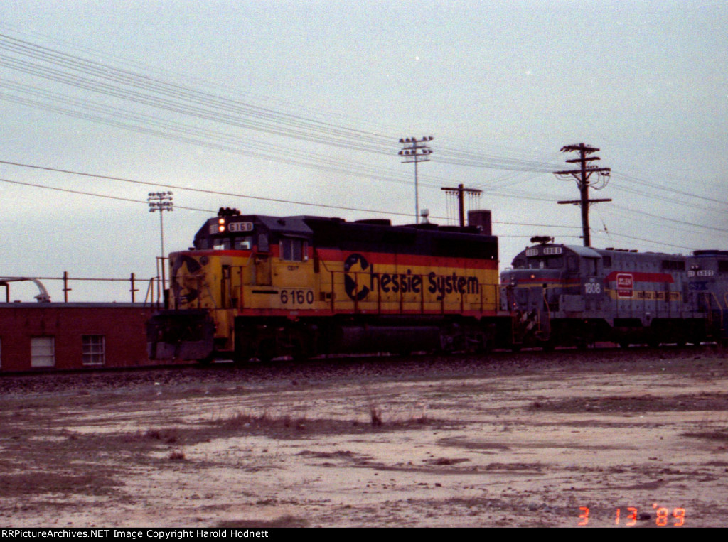 CSX 6160 leads a train northbound past the hump tower